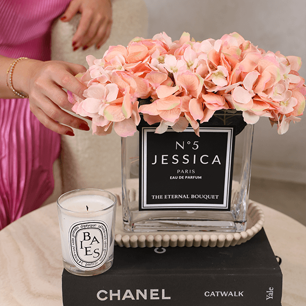 Luxury personalised glass vase with blush pink scented silk hydrangeas in a styled home setting