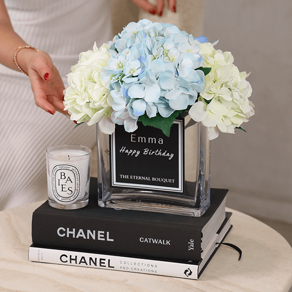 Luxury personalised glass vase with blue and white scented silk hydrangeas in a modern home setting