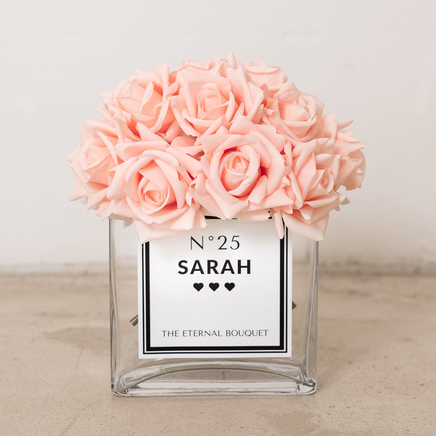 Champagne real touch roses in a personalised rectangular glass vase with personalised label.