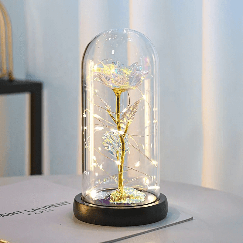 Elegant white galaxy rose with gold stem and LED fairy lights, displayed in a glass dome with a black base—an everlasting floral gift for birthdays, weddings, and anniversaries.