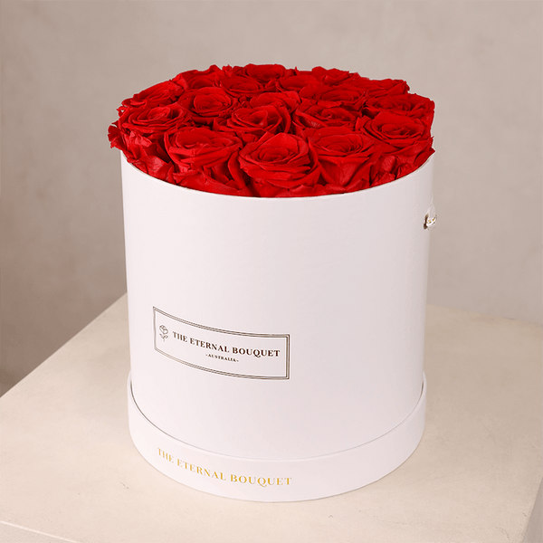 Red everlasting roses in a round white rose box by The Eternal Bouquet