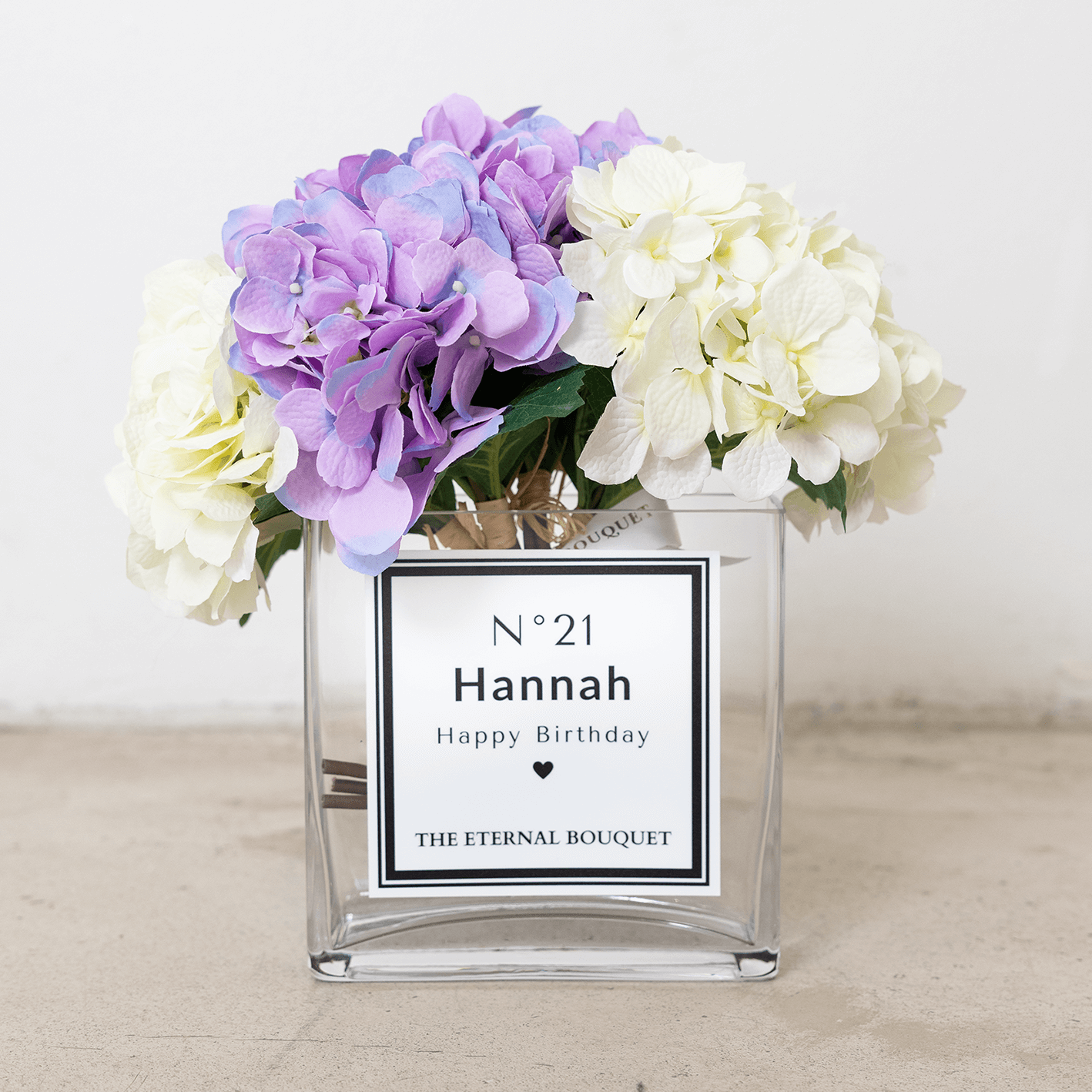 Personalised glass vase with purple and white scented silk hydrangeas