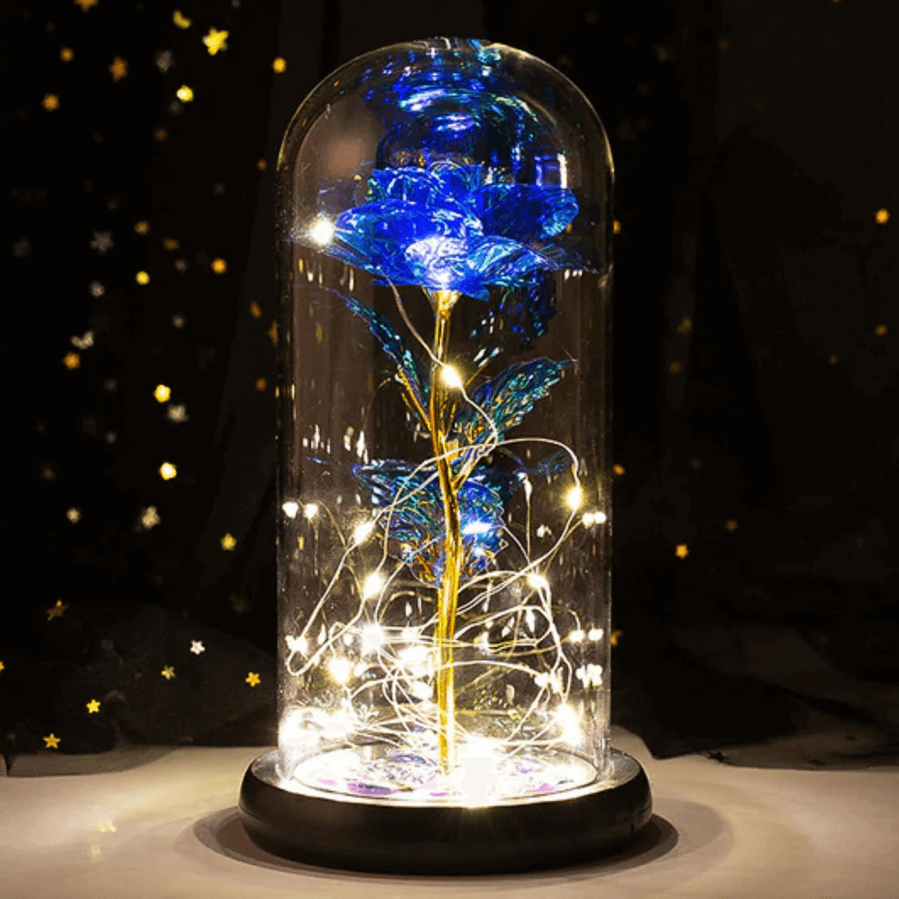 Blue galaxy rose with LED fairy lights inside a glass dome, featuring a gold stem and black base, perfect for romantic or luxury gifting.