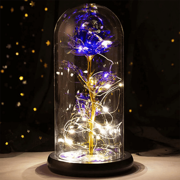 Enchanted galaxy rose in deep purple with glowing LED lights, encased in a glass dome with a black base, an elegant gift for special occasions such as birthdays and anniversaries.