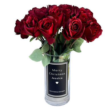 A bouquet of everlasting red roses arranged in a sleek glass vase with a personalized message. A timeless gift for partners, perfect for anniversaries, special occasions, or celebrating love that lasts forever.