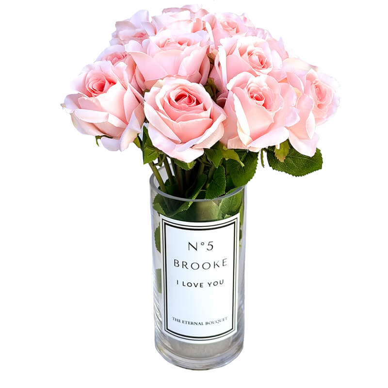 A luxurious bouquet of soft pink preserved roses arranged in a personalized glass vase. The elegant design from The Eternal Bouquet makes for a timeless and romantic gift, symbolizing love and appreciation with flowers that last forever.