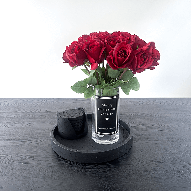  stunning bouquet of everlasting red roses arranged in a personalized glass vase. This elegant display makes the perfect timeless gift for a loved one, celebrating romance and special moments that last forever.
