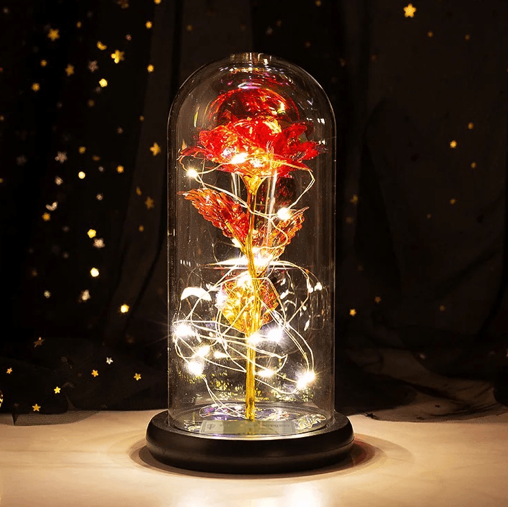 Enchanted red galaxy rose with glowing LED fairy lights in a glass dome, a stunning decorative piece and the perfect gift for special occasions like birthdays, anniversaries, and Mother's Day.