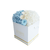 Long lasting Blue and White Rose and Hydrangea arrangement in a white Box side view