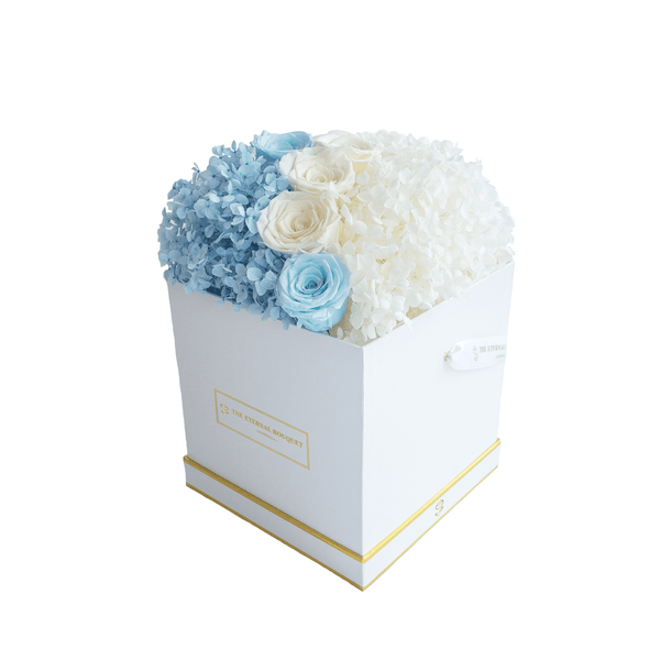 Long lasting Blue and White Rose and Hydrangea arrangement in a white Box side view