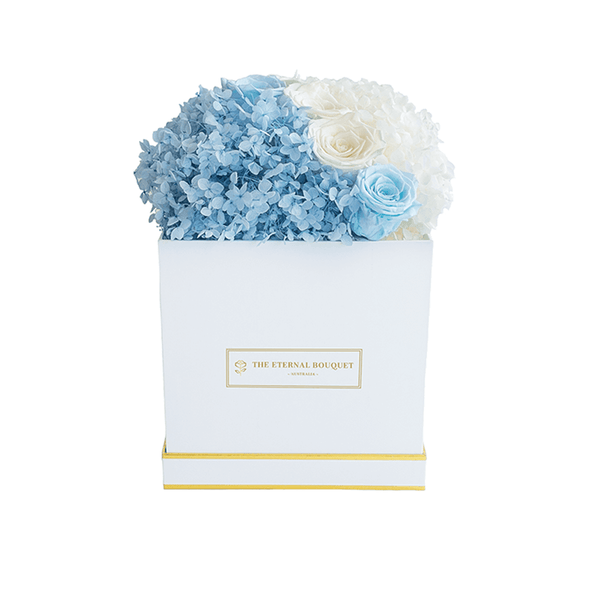 Long lasting Blue and White Roses and Hydrangeas in a white Box front view