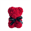 A stunning red rose teddy bear from The Eternal Bouquet, crafted entirely from vibrant everlasting roses and tied with an elegant black ribbon featuring gold foil branding. A romantic and lasting alternative to traditional floral gifts, this bear is perfect for Valentine’s Day, anniversaries, or any special occasion where love and thoughtfulness are celebrated.