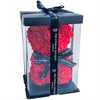 A luxurious red rose teddy bear from The Eternal Bouquet, beautifully encased in a clear display box and topped with a black ribbon featuring elegant gold branding. This eye-catching, handcrafted gift combines charm and sophistication, making it a memorable keepsake for romantic gestures, proposals, or milestone celebrations. A timeless symbol of love that never fades.